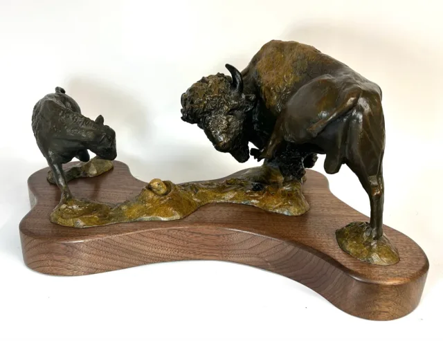 Sculpture of a grown buffalo and  calf by Pamela Winters