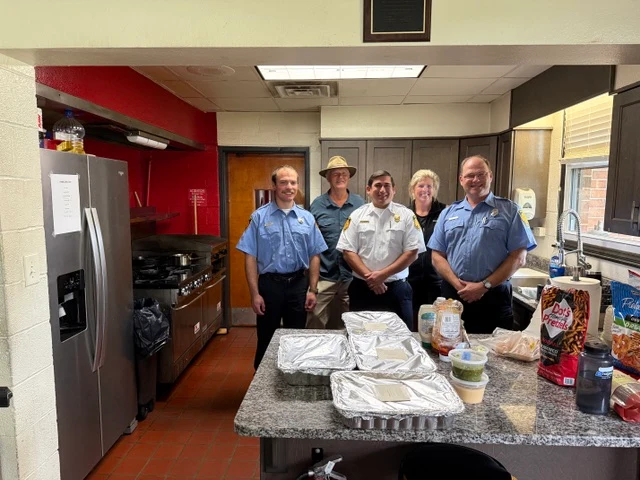 Stephanie and John Burk with the Raleigh Firefighters